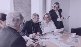 A team meeting with charts on the table